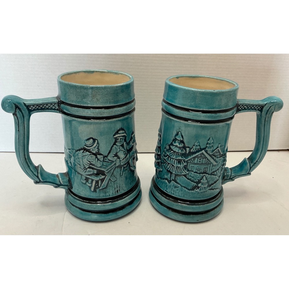 Vintage Ceramic Beer Stein Set 2pc Teal Blue Relief Cabin Scene 6in